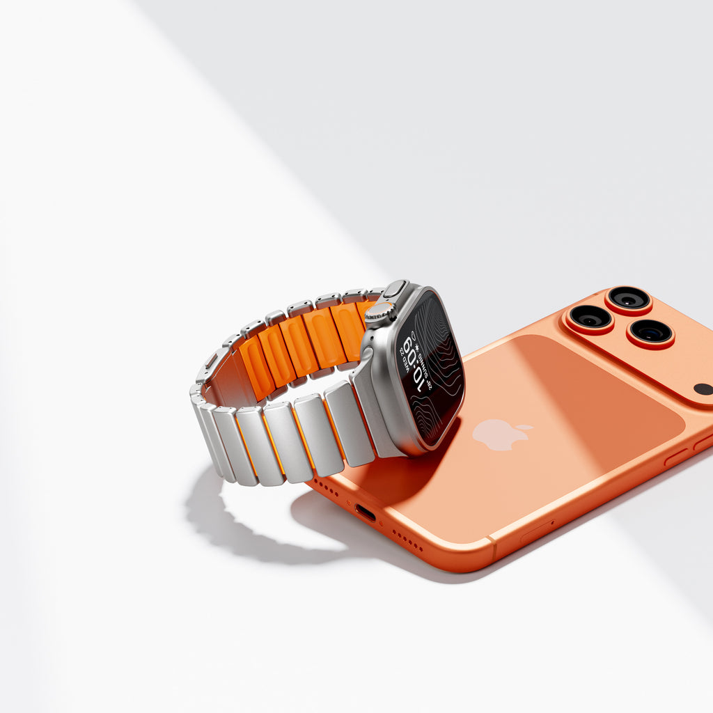 Titanium link band with orange silicone core, side view