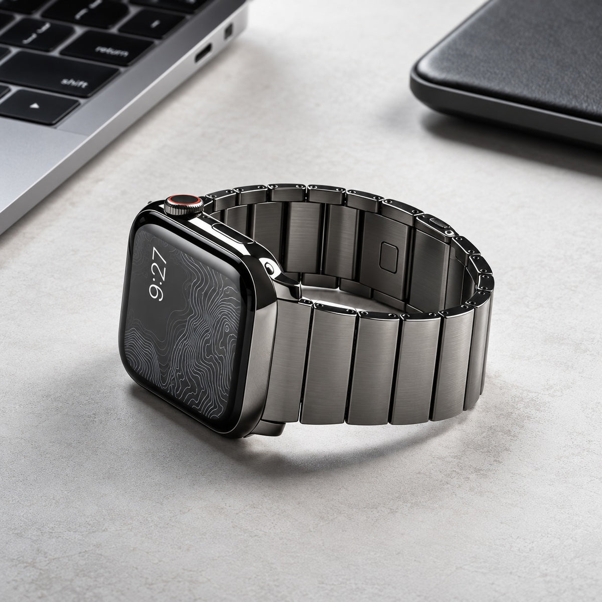 Flat-Link Titanium Band for Apple Watch, Gray, on a desk