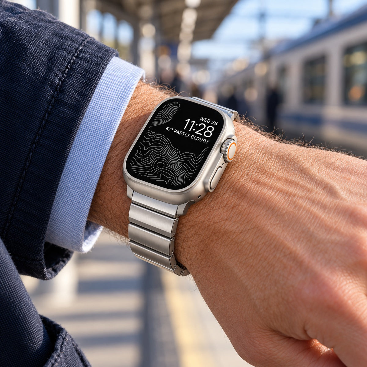 Flat-Link Stainless Steel Band for Apple Watch, Silver, worn on the wrist while commuting