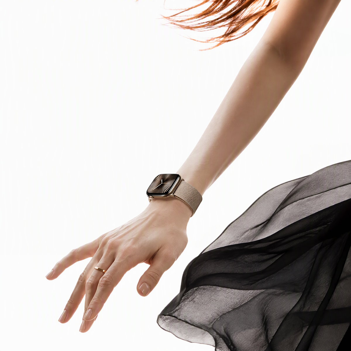 Milanese mesh Apple Watch band styled with a dress