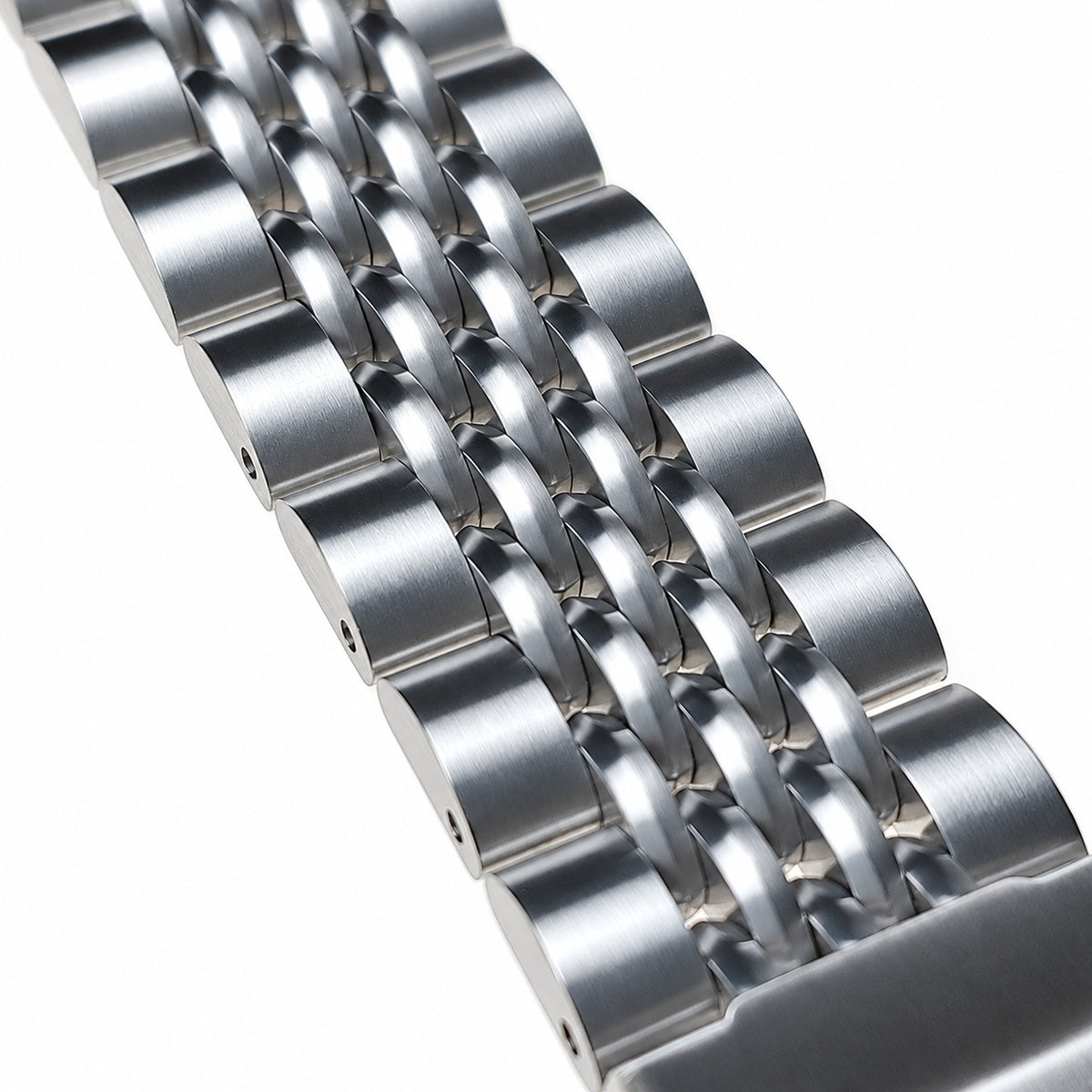 Close-up of polished beads and brushed links