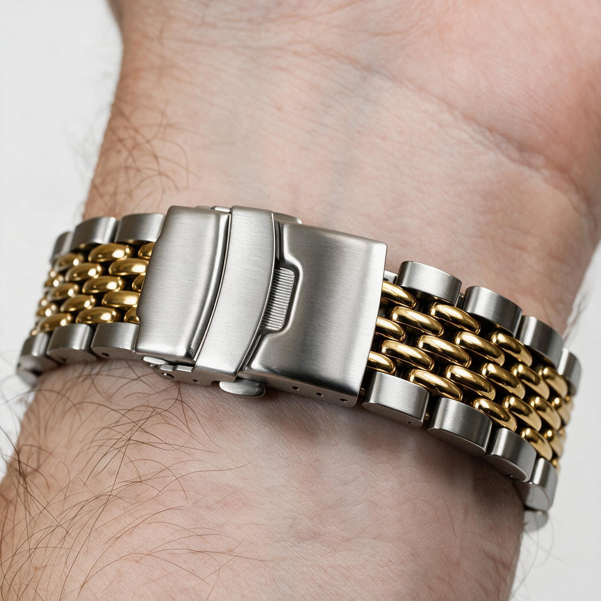 Two-tone gold beads of rice bracelet on the wrist