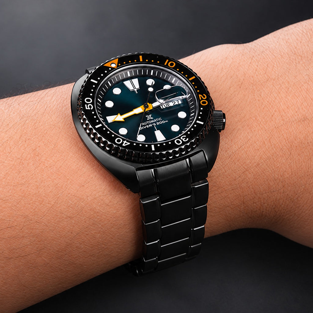 Black curved end stainless steel bracelet worn on a Seiko Turtle-style dive watch